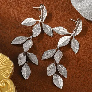 Elegant textured silver leaf drop earrings with delicate branch-inspired cascading design
