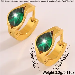Macro view of gold-plated huggie earrings with a green teardrop zircon and dimensions