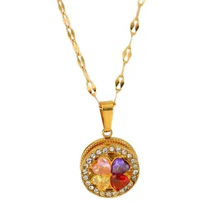 Elegant gold titanium steel necklace featuring a four-leaf clover pendant with multi-color stones