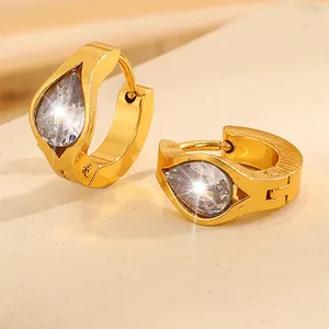 Close-up of golden stainless steel hoop earrings with teardrop zirconia stones