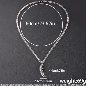 Macro shot of silver wheat chain with a vintage claw pendant and dimension measurements