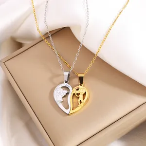 Polished titanium steel interlocking heart necklaces with gold and silver finishes