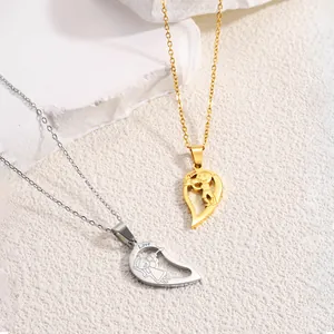 Detail of couple necklaces showing half-heart puzzle pendants with You and Love engraving