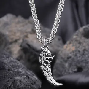 Detailed close-up of a dragon head wolf tooth pendant on a steel rope chain