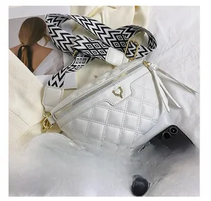 Quilted white crossbody bag set with phone for size comparison and wide strap