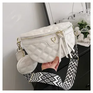 White quilted crossbody bag with gold deer head detail and woven shoulder strap
