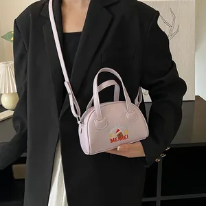 Detail of light purple Boston bag with cute dog embroidery and thin adjustable strap