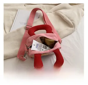 Pink canvas bag interior view showing storage capacity for daily essentials