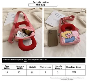 Size chart and dimensions for the pink canvas mini crossbody bag with cartoon illustration