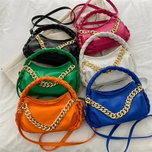 Chic multi-color chain shoulder bags with woven handles and vibrant PU leather finish