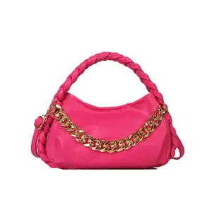 Magenta crescent moon shoulder bag with gold chain strap and woven top handle