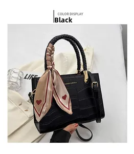 Chic black tote bag with crocodile texture, woven handle and heart print silk scarf