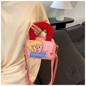 Pink cartoon illustration canvas bag with padded red handle and adjustable strap