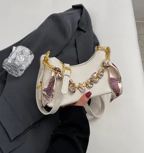 Off-white lychee leather handbag with silk scarf chain handle and adjustable strap