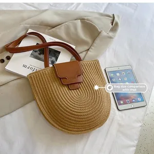 Size comparison of a woven shoulder bag next to an iPad for scale and dimension
