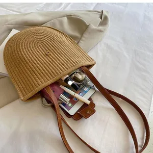 Top view of straw bucket bag interior showing capacity for tablet and cosmetics