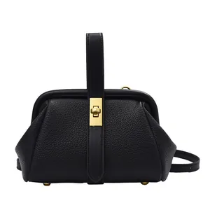 Sac à main classique en cuir litchi noir avec cadre métallique doré et poignée élégante