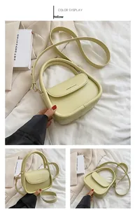 Detailed macro view of yellow fashion handbag showing smooth synthetic leather and flap design