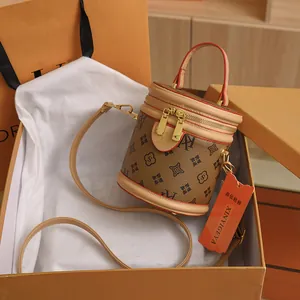 Vintage brown monogram bucket bag with top handle and strap in luxury gift box