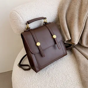 Retro dark brown PU leather backpack for women with gold buckles and school style
