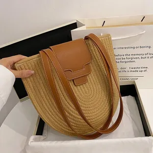 Handcrafted straw tote bag with brown leather lid and handle for summer casual style