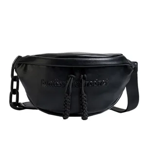 Modern black crescent moon bag with textured leather and decorative chain strap details