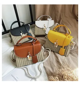 Detail of four colorful straw crossbody bags with leather flaps and cotton rope straps