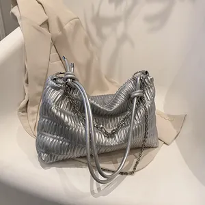 Silver pleated tote bag with knot straps and metallic finish for office wear