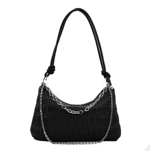Fashionable black pleated shoulder bag with silver chains and knot strap design