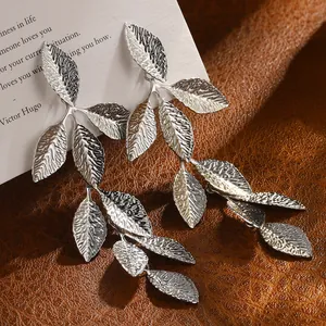 Silver leaf drop earrings in stainless steel with detailed vein textures and long dangle style