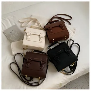 French vintage satchel bags in four matte leather colors with dual buckles and top handle