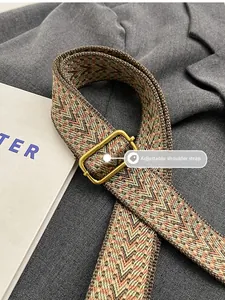 Adjustable woven shoulder strap for handbags with vintage herringbone texture and gold buckle