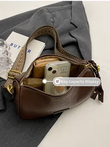 Brown vintage Boston bag detail showing interior storage capacity for daily essentials