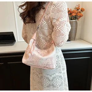Pink velvet cloud bag with beaded handle and traditional Chinese landscape patterns