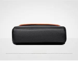 Detail view of black lychee grain leather handbag base with precise stitching craft
