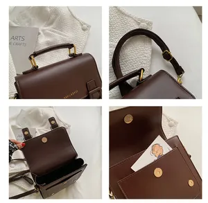 Macro detail of dark brown vintage satchel with gold hardware and magnetic closures