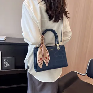 Dark blue crocodile pattern handbag with heart scarf and woven handle for women