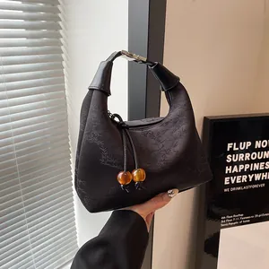 Elegant black jacquard beaded handbag with bamboo leaf texture and amber beads