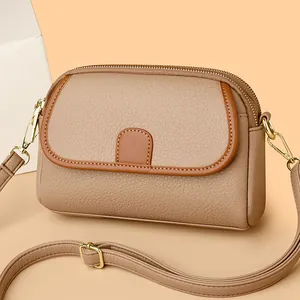 Elegant khaki leather crossbody bag with brown trim and litchi texture for women
