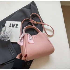 Pink lychee texture shoulder bag for women with decorative plaid scarf and long strap
