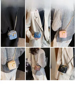 Detailed grid of mini denim and leather crossbody vanity bags with chain straps