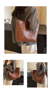 Detail of vintage brown patchwork tote bag with high-quality textured PU leather and long straps