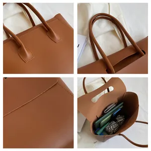 Details einer braunen Ledertasche mit verstärkten Nähten und geräumigem Innenraum