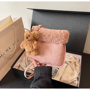 Pink lamb wool tote bag with a cute brown bear charm in an elegant gift box presentation