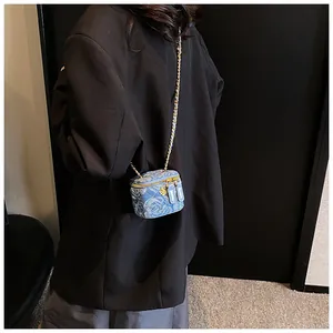 Mini blue denim crossbody box bag with white rose pattern and gold chain strap