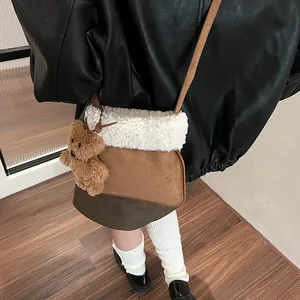 Vintage brown faux suede crossbody bag with white sherpa trim and bear charm