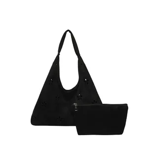 Black frosted suede petal hobo bag with laser-cut hollow design and matching small pouch