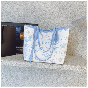Close-up of the cute cartoon graffiti prints on a white large-capacity tote bag