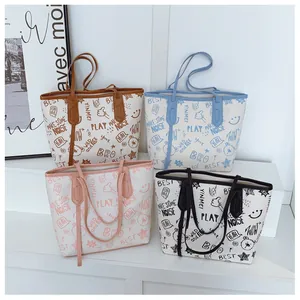 Detailed view of four large tote bags featuring colorful cartoon graffiti and urban prints