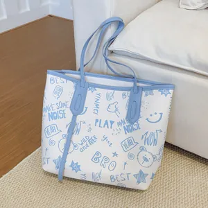 Large capacity tote bag with blue cartoon prints and stars on white faux leather